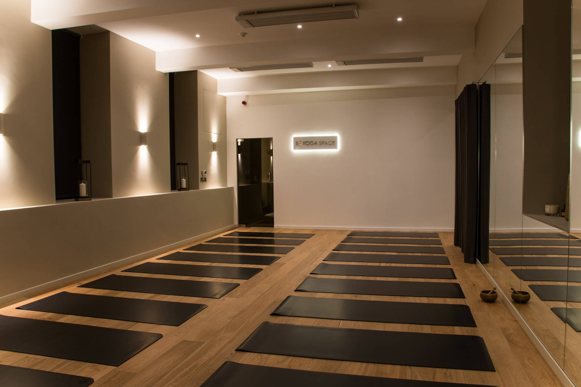 Be Yoga Space full hot yoga studio view dimmed lights